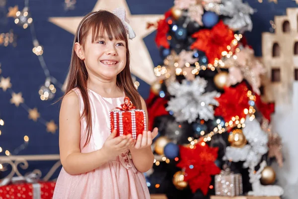 Girl rejoices at New Year's gift — Stock Photo, Image