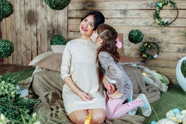 Daughter kisses mom on the cheek, mom with her daughter happily — Stock Photo, Image