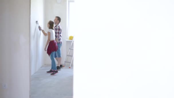 Father and daughter painting wall — Stock Footage Father and daughter painting wall Video Clip