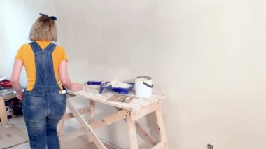 Young woman makes repairs