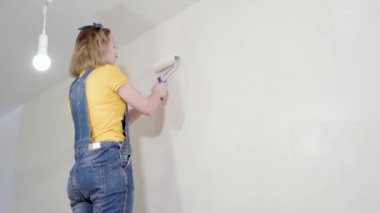 Young woman makes repairs