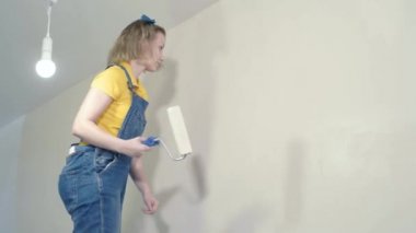 Young woman makes repairs