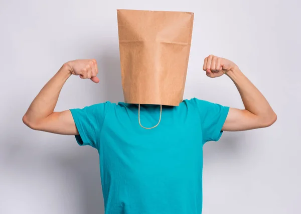 Boy with paper bag over head