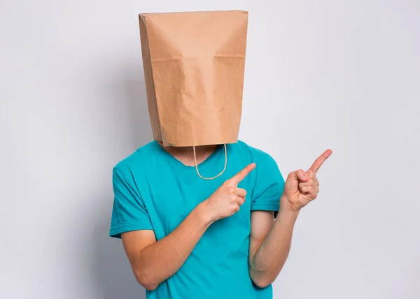 Boy with paper bag over head