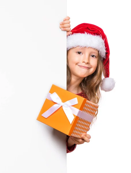 Weihnachtskind zeigt Tafel — Stockfoto