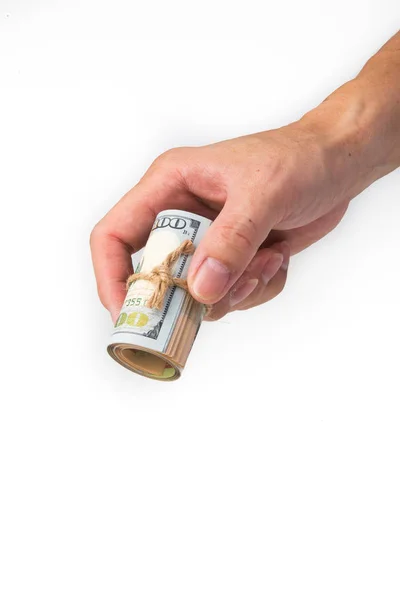 Hand holding a roll of 100 usd — Stock Photo, Image