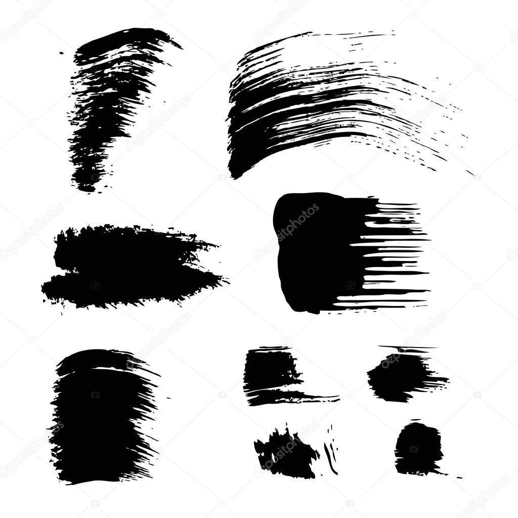 Ddifferent forms of black textured smears  isolated on a white background