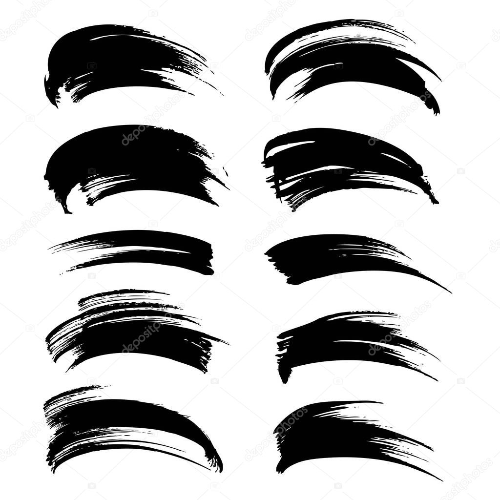 Abstract textured black ink brushstrokes set isolated on a white background