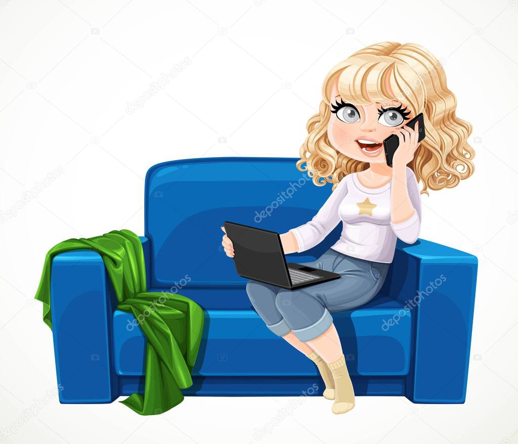 Cute blond girl sitting with laptop and phone on the small blue couch and buys something online  isolated on white background