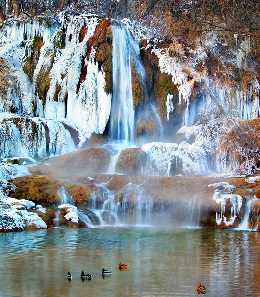 A freezing cold winter at waterfall with, so believed, healing water in Lucky village, in Ruzomberok district, Zilina region, northern Slovakia. This village is wide popular tourist destination known for its spa resorts founded in the 18th century.