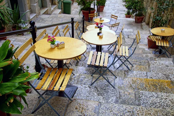 VALLETTA, MALTA - APR 10, 2018 - Outdoor restaurant table and chairs Valletta, Malta