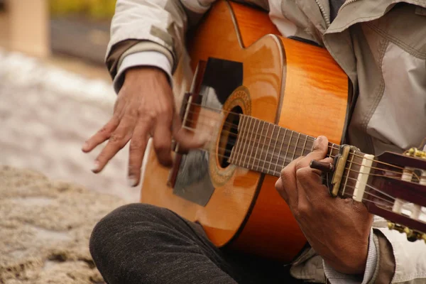Fingers of flamenco guitar player in the Grenada, Spain