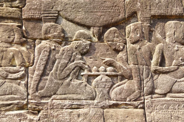 Playing a board game,  bas relief sculpture in Bayon, Angkor Thom,  Siem Reap, Cambodia