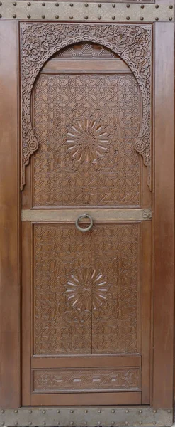 Large ornate doors of a luxury hotel