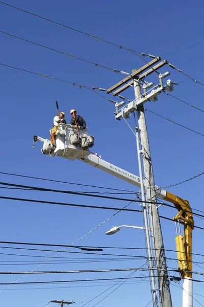 City crews working on utility pole