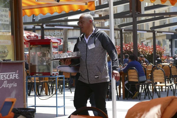 Serving tea in an outdoor restaurant