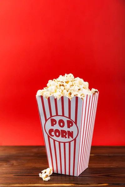 Red and White Bucket Of Popcorn. Movie background with copy space.