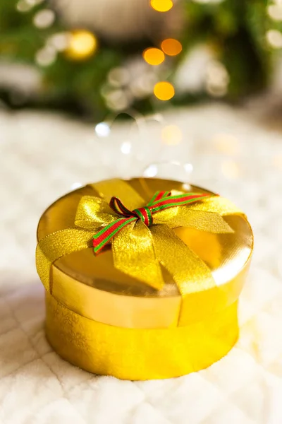 golden round gift boxes sparkling with bow on Christmas background