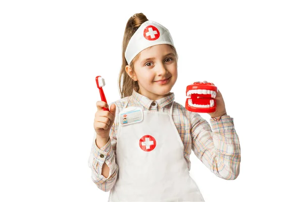 Feliz sorrindo bebê menina com ferramenta dentista — Fotografia de Stock