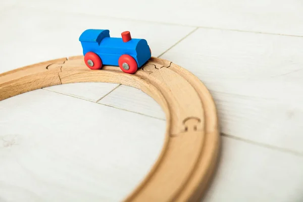 Child'd wooden train on the white floor — Stock Photo, Image