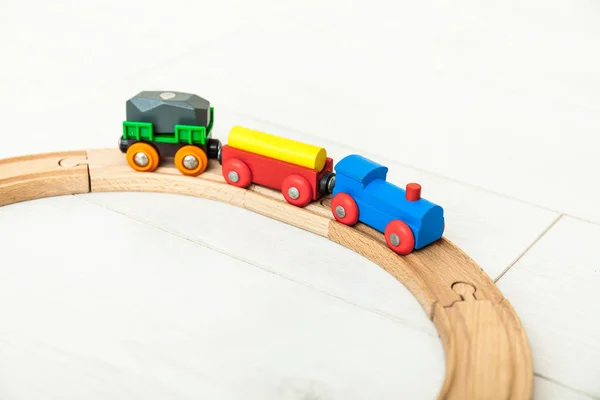 Child'd wooden train on the white floor — Stock Photo, Image