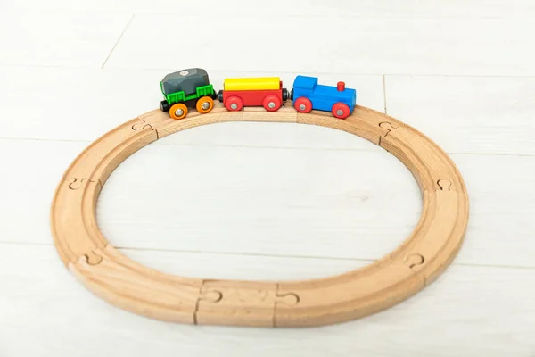 Child'd wooden train on the white floor — Stock Photo, Image