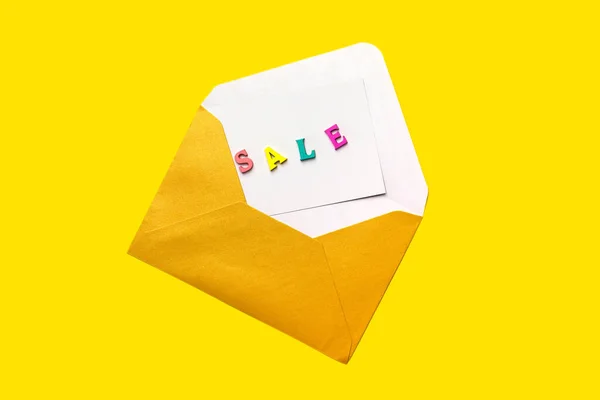 Sale Note Made Wooden Letters Open Envelope Isolated Yellow Background — Stock Photo, Image