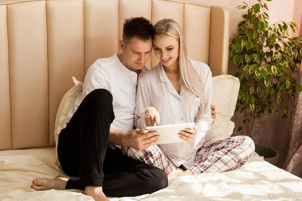 Pregnant Woman Man Lying Bed Home Shopping Online Looking Something — Stock Photo, Image