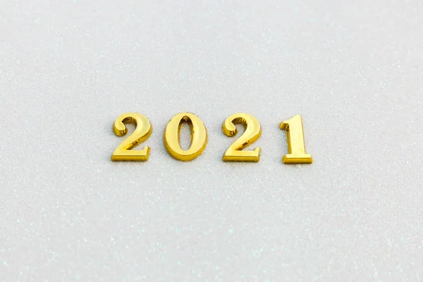 Happy New year 2021 celebration. Gold numeral 2021 on white sparkle background