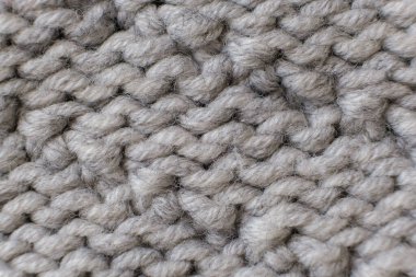El yapımı gri örgü yün dokusu arka planı kapat, seçici odak