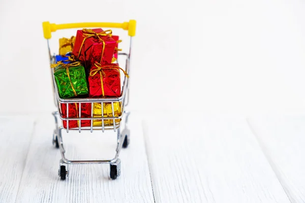 Multiple Colors Gift Presents Boxes Shopping Cart Sales Promotion Rewards — Stock Photo, Image