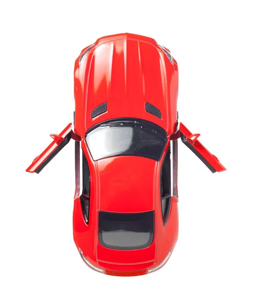 オープンドア スポーツクーペボディ 選択的フォーカス 白い背景に隔離された赤いおもちゃの車のモデルトップビュー — ストック写真