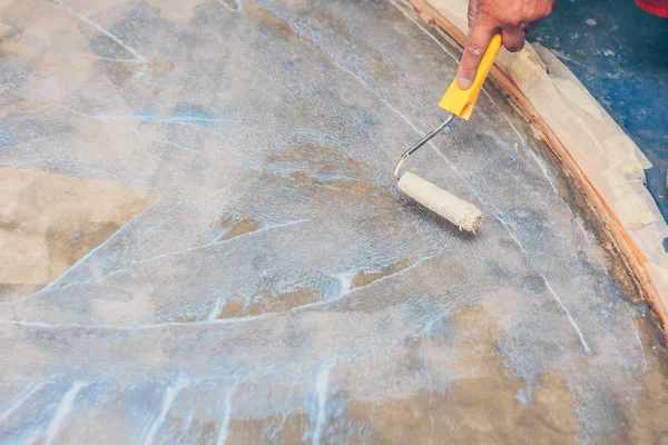 Finishing works - priming of the floor for the bulk floor