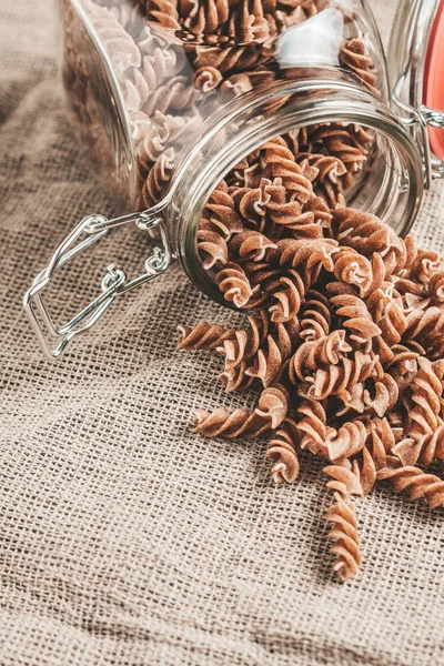 Raw Italian Pasta Glass Jar Linen Kitchen Vertical Format Close — Stock Photo, Image