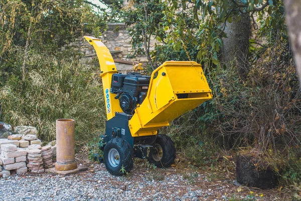 Large yellow garden machine for cleaning fallen leaves - leaf blower