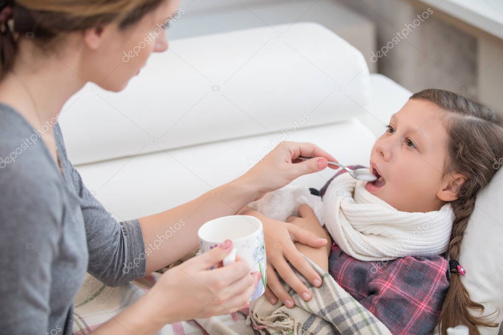 caring mother cures a young daughter for the disease at home