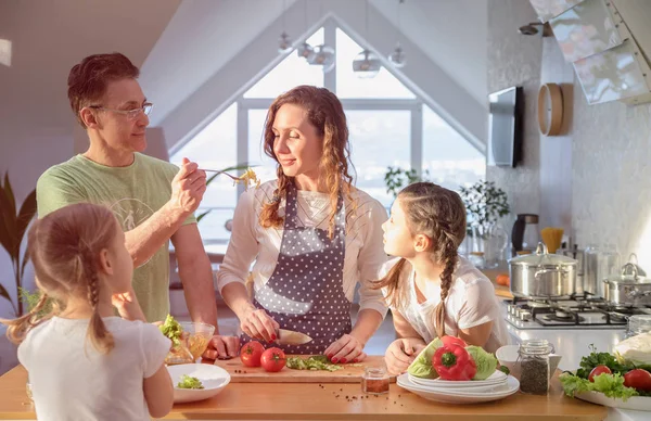 Family cooking in the kitchen at home — Stock Photo, Image