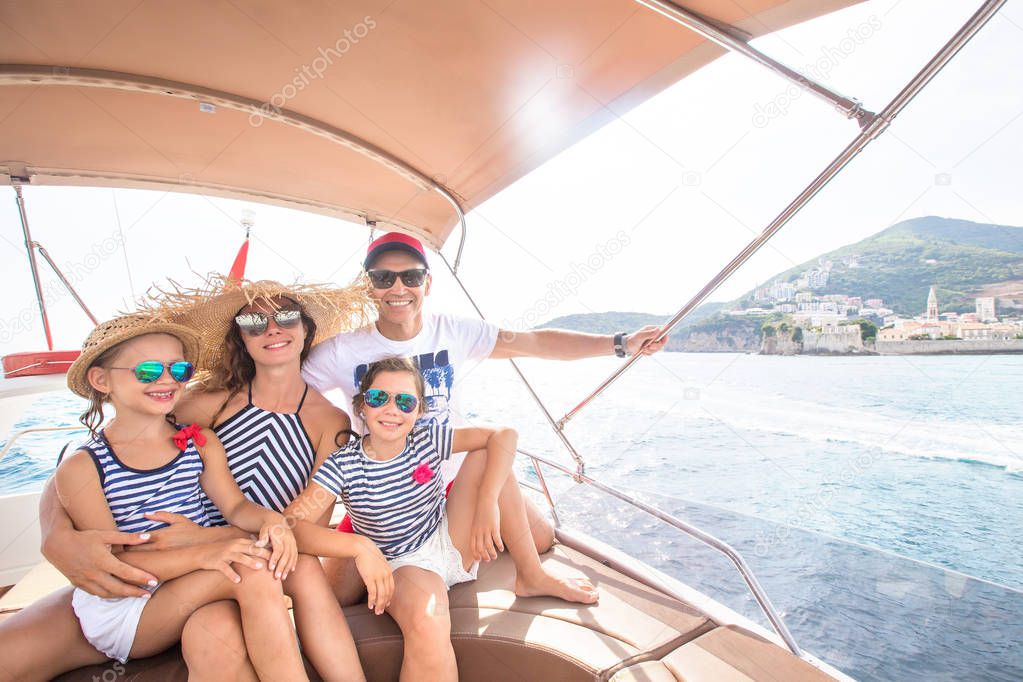 family on sea yacht