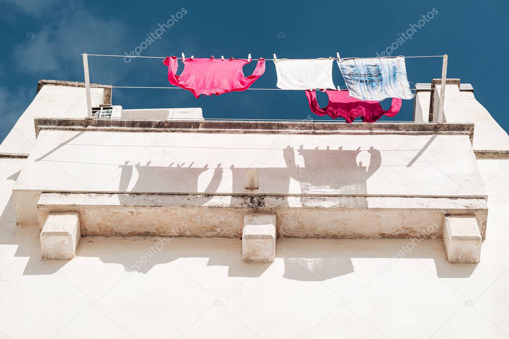 MARTINA FRANCA, ITALY / SEPTEMBER 2019: Clothes drying at the su