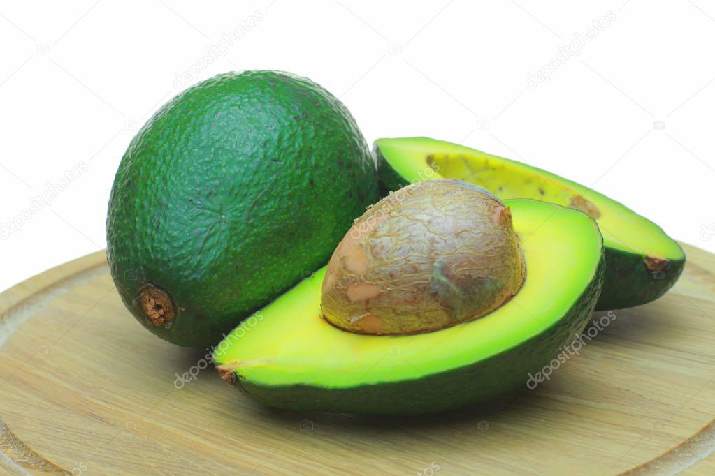 Ready-to-eat avocados. . On a white background lies the fruit avocado as a background