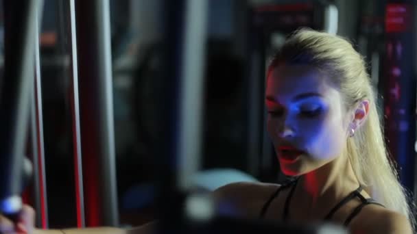 The girl in the gym shakes her chest. — Stock Footage The girl in the gym shakes her chest. Royalty Free Stock Video