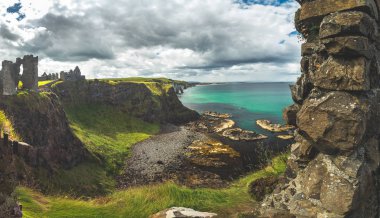 The overview from Dunluce castle to the Irish bay. clipart
