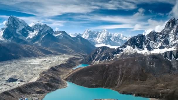 Gokyo Lakes surrounded by rocky hills against high mountain — Stock Video