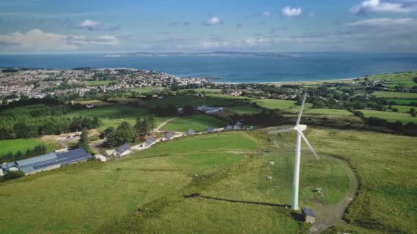 Irish port town windmill aerial view: solar station, Ballycastle pier, Atlantic ocean bay at summer — Stock Video