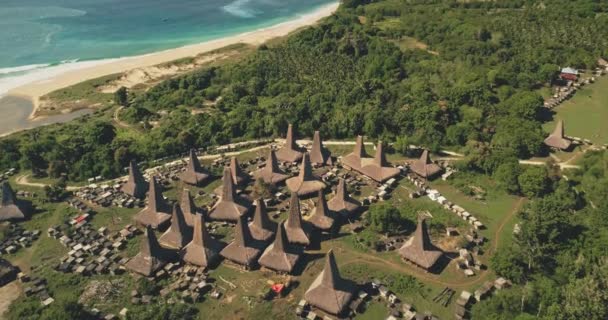 Traditional village, houses roofs closeup top down aerial view. Epic rural scenery of Sumba Island — Stock Video