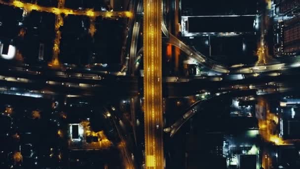 Top down night city traffic highway at lantern light with cityscape aerial view. Twilight illuminate — Stock Video