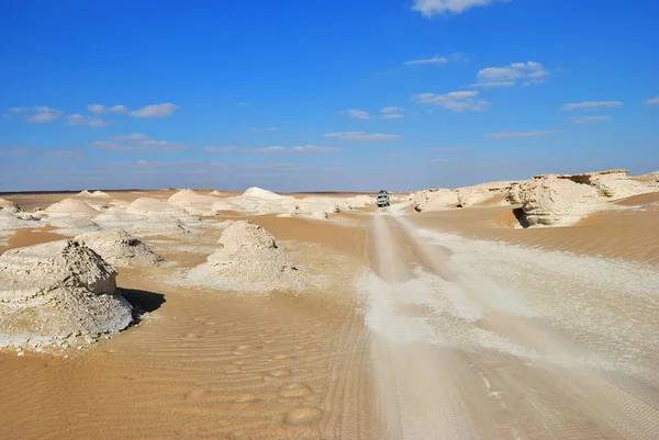 Off-road car  in the Tent valley desert. Western white desert. Extreme desert safari is one of the main local tourist attraction in Egypt