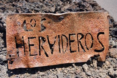 Los Hervideros iron sign. Lanzarote, Canary Islands, Spain  clipart