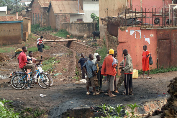  Kampala, Uganda - August 25, 2010: Local teenagers buy a drugs in slum. Nearly 40% of slum dwellers have a monthly income of just 2,500 shillings less than a dollar