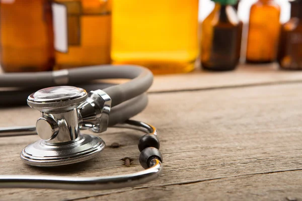 Workplace Doctor Stethoscope Pharmacy Bottles Wooden Desk — Stock Photo, Image